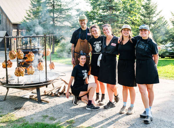 Kitchen team and their hanging chickens. Photo by Isora Lithgow