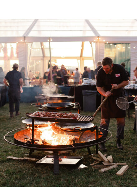 Chef/Owner Luke Stone stokes the fire. Photo by Great Blue Photo Co. 