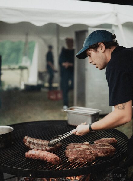 Head Chef Forest grilling steaks. Photo by Carolina Rivera